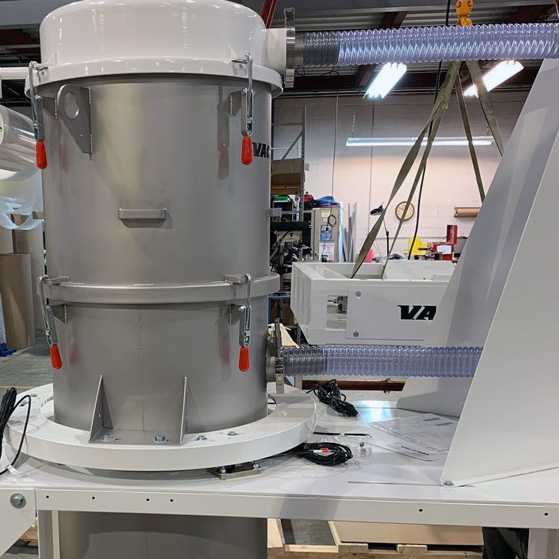 22” diameter batch-weigh receiver with offset cone hopper and 10” wafer valve. Inlet/outlet hose support isolates receiver for high-accuracy weighing.