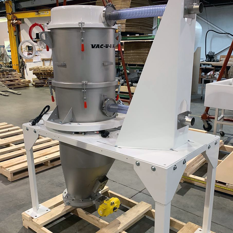 22” diameter batch-weigh receiver with offset cone hopper and 10” wafer valve. Inlet/outlet hose support isolates receiver for high-accuracy weighing.