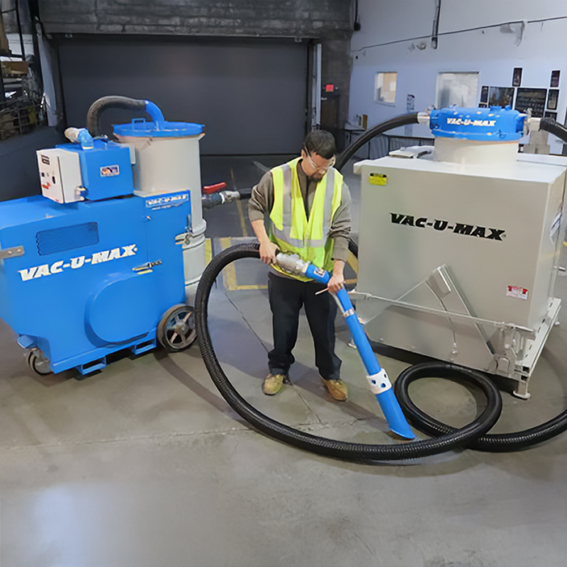 322-01 bottom dump hopper with 2-yard capacity used in conjunction with a VAC-U-MAX MDL1050 Heavy-Duty Vacuum Unit.