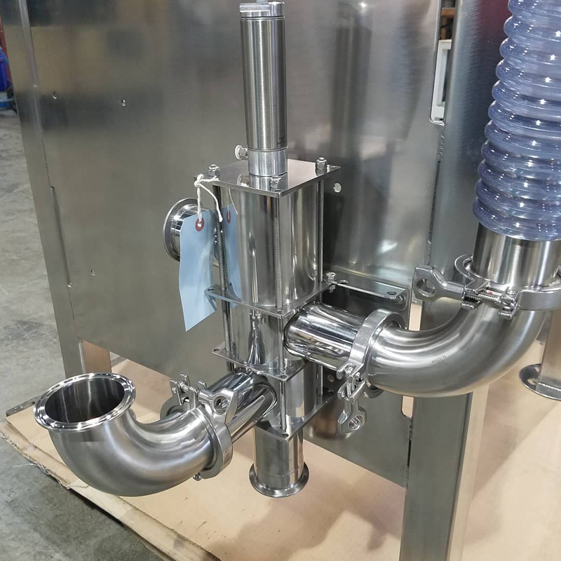 Sanitary low-pressure valve detail on a floor-standing blender loader filter assembly