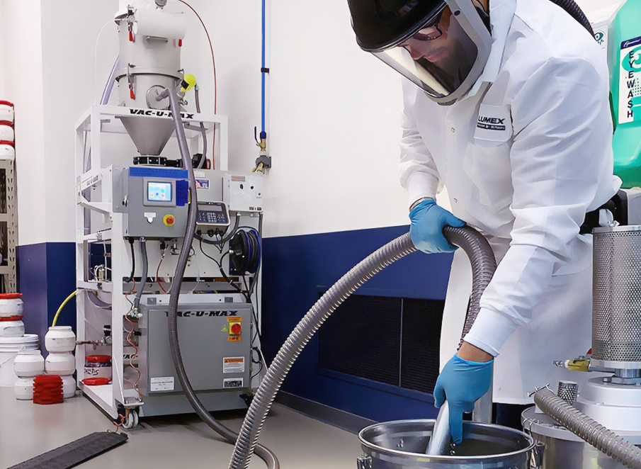 Lumex engineer using the VAC-U-MAX MPRS metal powder recovery system