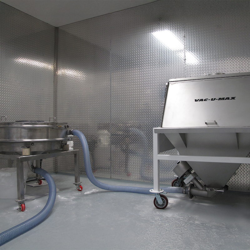 Bag dump station with in-line check sieve